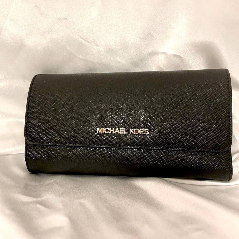 Michael Kors large leather trifold wallet.  Gently used.